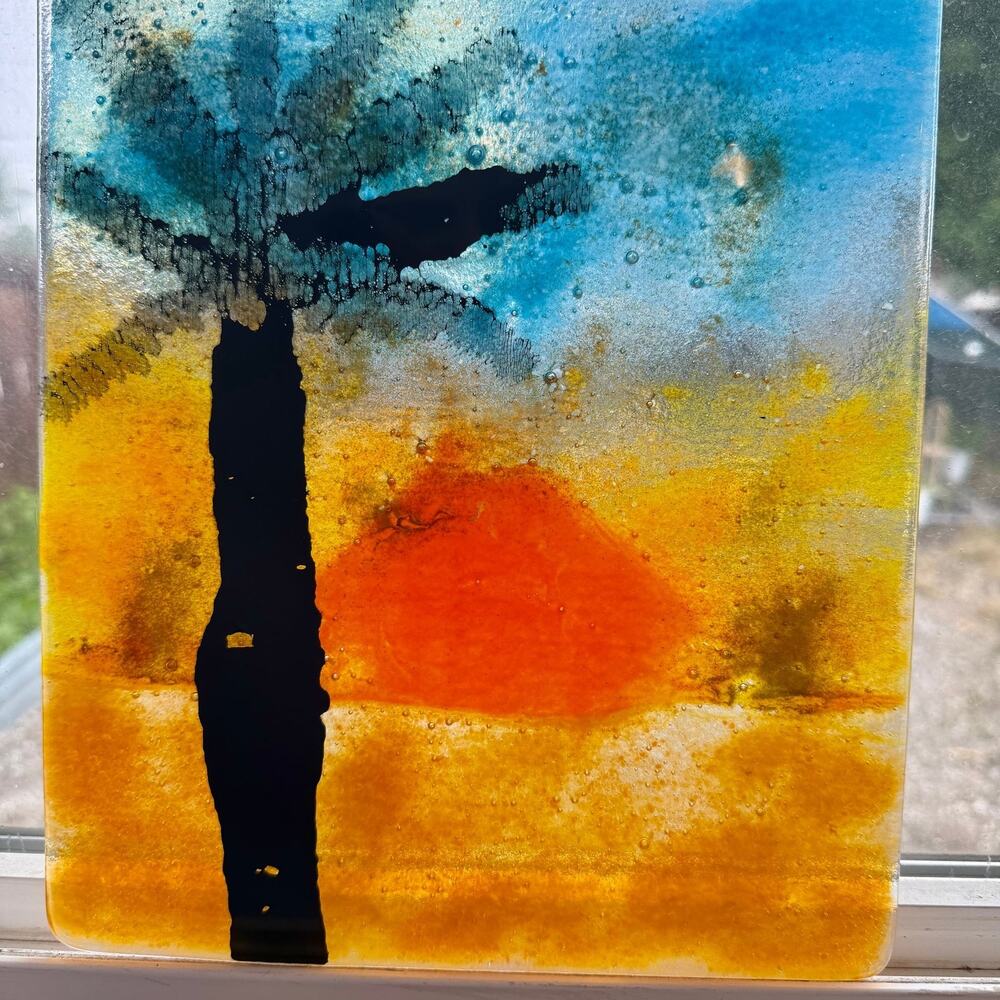 Vintage Fused Glass Art Panel depicting a sunset with a palm tree 9”x10.5”